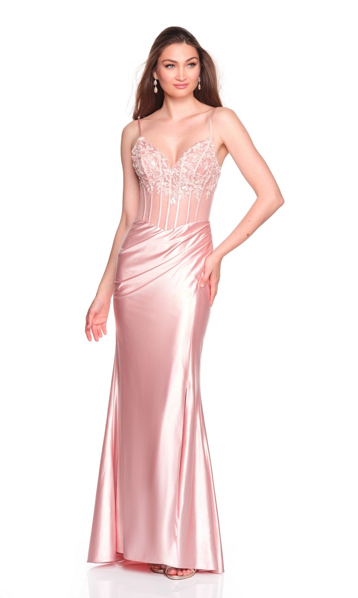A woman stands on a plain background wearing the Long Prom Dress: Dave and Johnny 12669, a light pink satin gown with spaghetti straps, floral embroidered fitted bodice, and flared skirt, showcasing its elegant prom style.